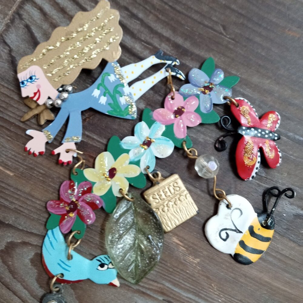 Brooch, Fanciful Flights by K. Rossi for Silvestri, Woman with gardening items,